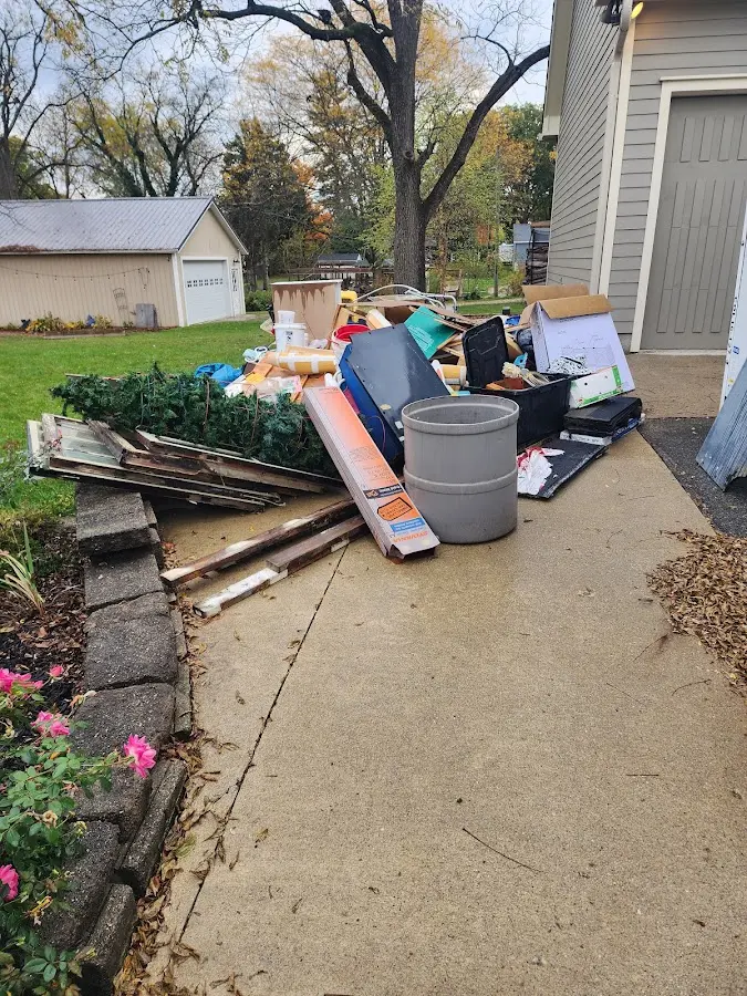 Dumpster being loaded with debris for 30 Yard Dumpster Rental in Dover